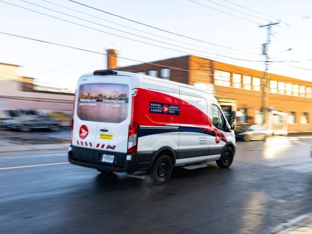 A Canada Post truck leaves a distribution centre in Montreal on Tuesday, Dec. 17, 2024.  THE CANADIAN PRESS/Christinne Muschi