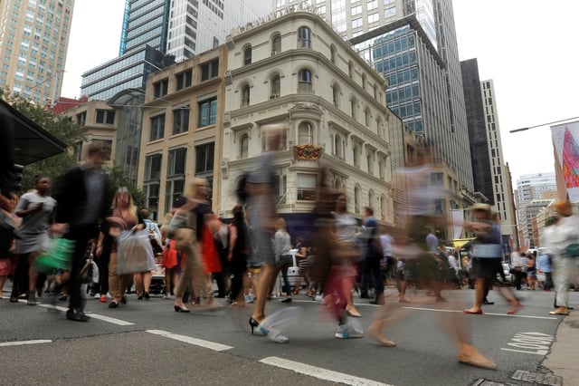Office workers walk the streets of Sydney, Australia December 7, 2016. REUTERS/Jason Reed/File Photo