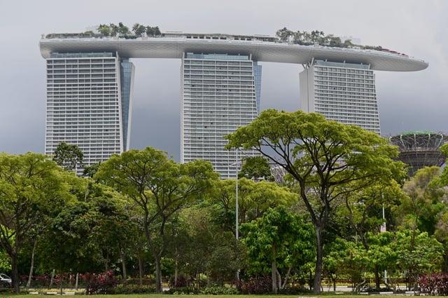 The Marina Bay Sands hotel and resort is seen past greenery in Singapore on October 4, 2019.