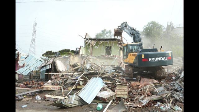 The operation targeted a 250-metre-long, 16-metre-wide stretch occupied by unauthorised huts, tin sheds, shops, and brick structures, which were cleared to make way for infrastructure development. (HT)