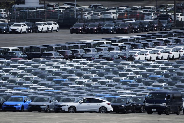 FILE - A car, center, is moved to another location of the area where export vehicles are parked at Daikoku Pier in Yokohama, near Tokyo, Tuesday, April 8, 2025. (AP Photo/Hiro Komae, File)