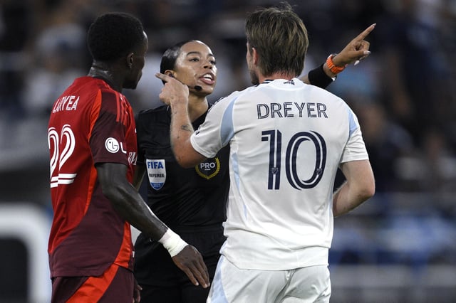SAN DIEGO, CALIFORNIA – JULY 16: Referee Alyssa Pennington talks to Anders Dreyer #10 of San Diego FC as Richie Laryea #22 of Toronto FC looks on during the first half at Snapdragon Stadium on July 16, 2025 in San Diego, California. (Photo by Orlando Ramirez/Getty Images)
