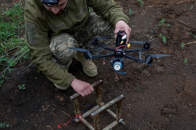 Nazar, 33, a Ukrainian serviceman of the 72nd Chorni Zaporozhtsi Separate Mechanized Brigade of the Ukrainian Armed Forces, prepares a first-person view (FPV) drone to launch it towards Russian troops, during the unilaterally proposed three-day ceasefire declared by Russia, amid Russia's attack on Ukraine, near a frontline in Dnipropetrovsk region, Ukraine May 8, 2025. REUTERS/Alina Smutko/File Photo