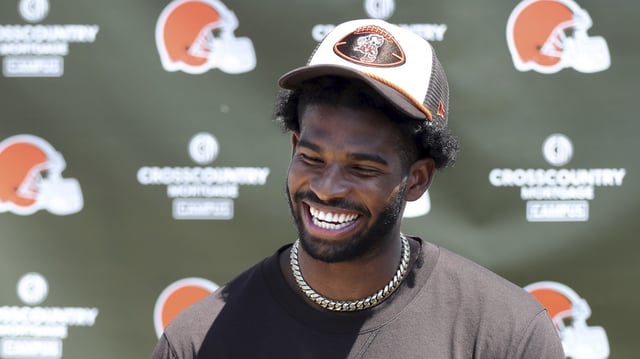 Cleveland Browns quarterback Shedeur Sanders (12) jokes about his signing bonus during a press conference before day two of NFL rookie minicamp at the Cleveland Browns training facility on Saturday, May 10, 2025, irea, Ohio.