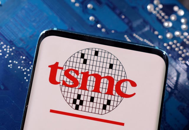 A smartphone with a displayed TSMC (Taiwan Semiconductor Manufacturing Company)  logo is placed on a computer motherboard in this illustration taken March 6, 2023. REUTERS/Dado Ruvic/Illustration/File Photo