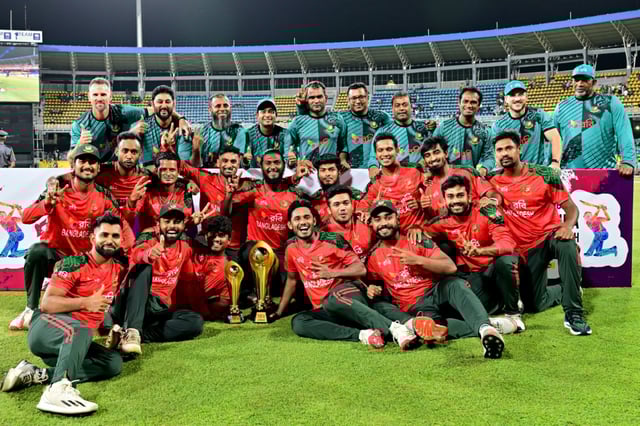 Bangladesh players pose with the trophy after winning the Third and final Twenty20 international against Sri Lanka