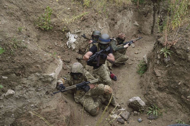 Ukrainian 3rd Assault Brigade recruits train at the polygon in Kyiv region, Ukraine, on Wednesday, July 16, 2025. (AP Photo/Evgeniy Maloletka)