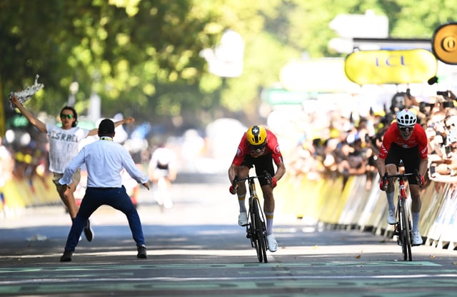 Stage winner Jonas Abrahamsen of Norway and Team Uno-X Mobility and Mauro Schmid of Switzerland and Team Jayco AlUla sprint at finish line during the 112th Tour de France 2025, Stage 11 a 156.8km stage from Toulouse to Toulouse / #UCIWT / on July 16, 2025 in Toulouse, France.