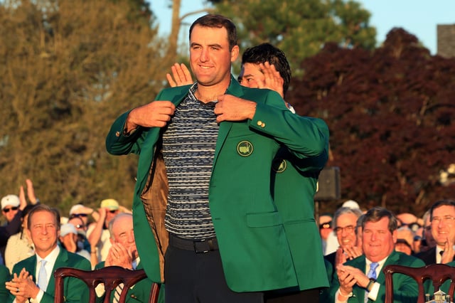 Scheffler is awarded the green jacket by 2021 Masters champion Hideki Matsuyama after he won the Masters at Augusta National Golf Club in 2022.