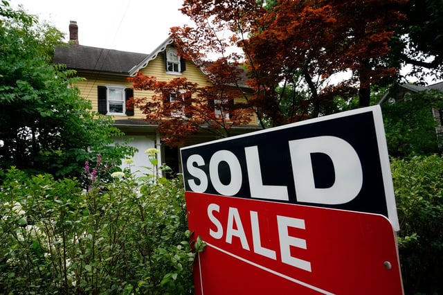 FILE - A sale sign stands outside a home in Wyndmoor, Pa., Wednesday, June 22, 2022.  The National Association of Realtors  has agreed on Friday, March 15, 2024, to pay $418 million and change its rules to settle lawsuits claiming homeowners have been unfairly forced to pay artificially inflated agent commissions when they sold their home.
  (AP Photo/Matt Rourke, File)