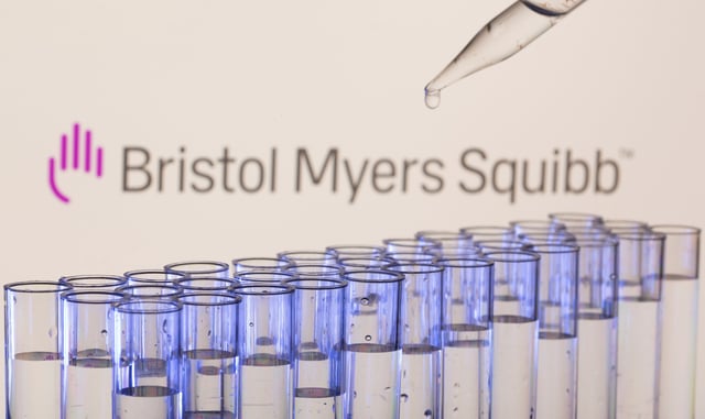 Test tubes are seen in front of a displayed Bristol Myers Squibb logo in this illustration taken, May 21, 2021. REUTERS/Dado Ruvic/Illustration/File Photo