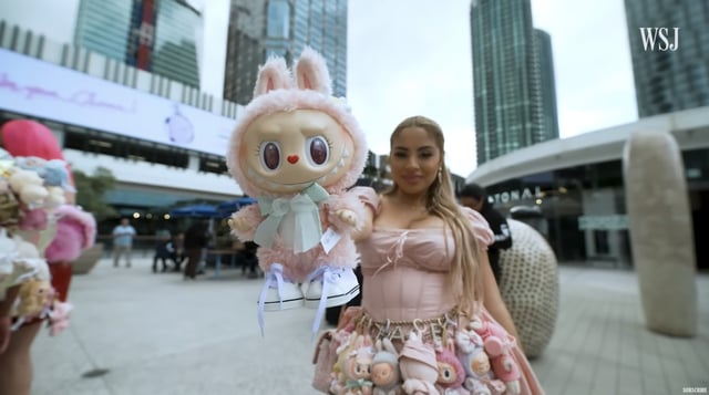 girl holding monster plush
