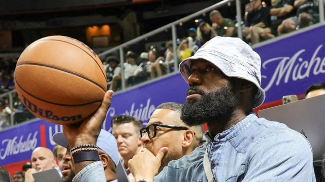 LeBron James of the Los Angeles Lakers throws the ball back to a referee as he attends a 2025 NBA Summer League game between the Lakers and the New Orleans Pelicans at the Thomas & Mack Center on July 12, 2025 in Las Vegas, Nevada. 