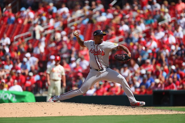 ST LOUIS, MISSOURI - JULY 13: Raisel Iglesias #26 of the Atlanta Braves pitches against the St. Louis Cardinals at Busch Stadium on July 13, 2025 in St Louis, Missouri.