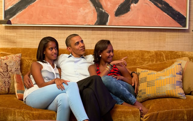President Barack Obama and his daughters, Malia, left, and Sasha, watch on television as First Lady Michelle Obama takes the stage to deliver her speech at the Democratic National Convention, in the Treaty Room of the White House, Tuesday night, Sept. 4, 2012.