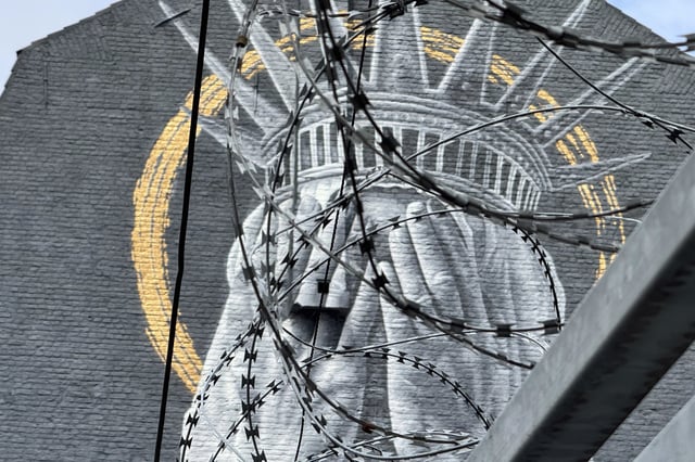 A mural by Dutch artist Judith de Leeuw shows the Statue of Liberty covering her eyes with her hands, in Roubaix, northern France, Monday, July 14, 2025. (AP Photo/Sylvain Plazy)