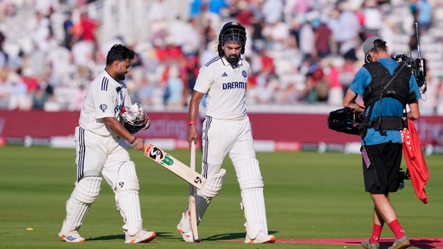 India's batters Rishabh Pant and KL Rahul walk off the field at the end of the second day's play at Lord's.