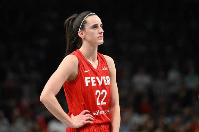 Caitlin Clark #22 of the Indiana Fever looks on against the Atlanta Dream on August 26, 2024 at State Farm Arena in Atlanta, Georgia.