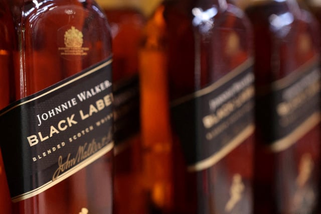 Johnnie Walker bottles are displayed on a shelf in a supermarket in Sarajevo, Bosnia and Herzegovina, October 29, 2024. REUTERS/Dado Ruvic/File Photo