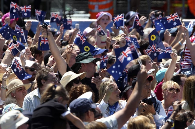 File photo of a crowd waving Australian flags, taken during the Great Aussie Barbecue in Perth, Australia, Saturday, Oct. 29, 2011.