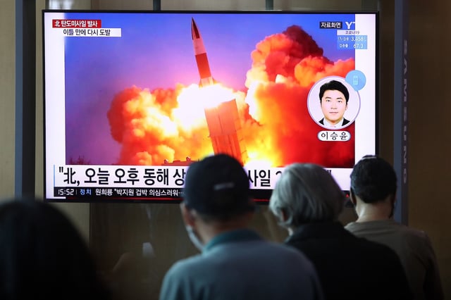 SEOUL, SOUTH KOREA - SEPTEMBER 15: People watch a TV at the Seoul Railway Station showing a file image of a North Korean missile launch, on September 15, 2021 in Seoul, South Korea. The unidentified type of missiles were fired from central inland areas of the North on Wednesday afternoon, and the South Korean and the U.S. intelligence authorities are analyzing details for additional information, the JCS said in a release. (Photo by Chung Sung-Jun/Getty Images)