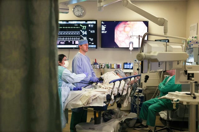 Dr. John Gaetano performs a colonoscopy on Mike Lowe, 45, at Northwestern Lake Forest Hospital on April 18, 2025.
