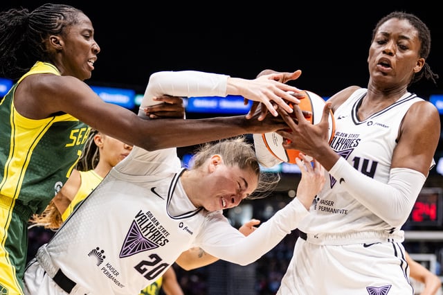 SEATTLE, WASHINGTON - JULY 16: Ezi Magbegor #13 of the Seattle Storm battles for the ball against Kate Martin #20 and Temi Fagbenle #14 of the Golden State Valkyries during the third quarter of the game at Climate Pledge Arena on July 16, 2025 in Seattle, Washington. NOTE TO USER: User expressly acknowledges and agrees that, by downloading and or using this photograph, User is consenting to the terms and conditions of the Getty Images License Agreement. (Photo by Jane Gershovich/Getty Images)
