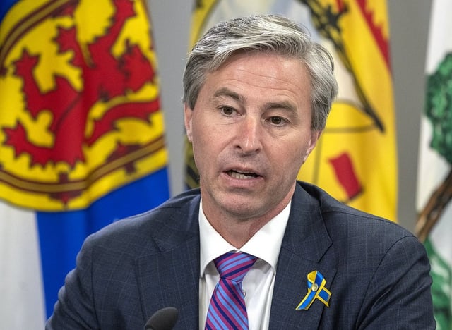 FILE - Nova Scotia Premier Tim Houston has threatened to overrule Halifax city council if it doesn't reverse its decision to create a new bike lane.