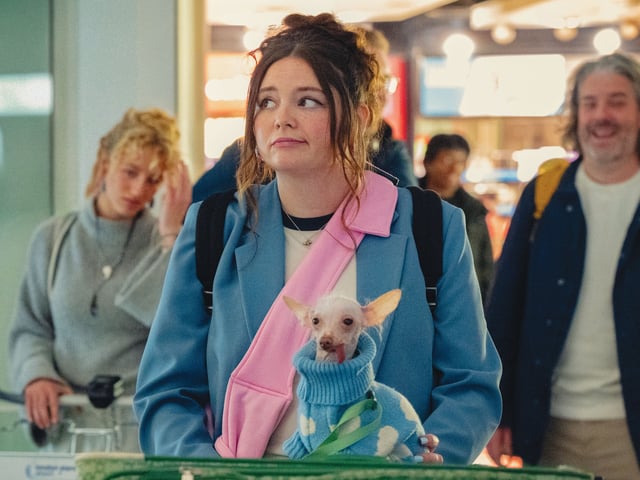 Meg Stalter the airport in Too Much