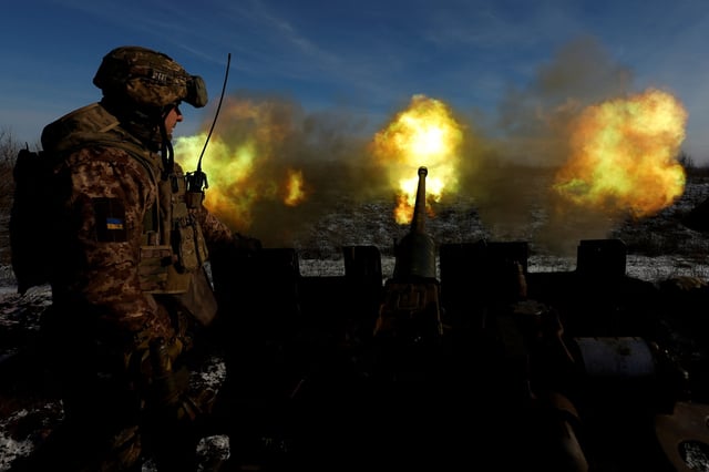Ukrainian members of the military fire an anti-aircraft weapon, as Russia's attack on Ukraine continues, in the frontline city of Bakhmut, Ukraine, January 10, 2023. REUTERS/Clodagh Kilcoyne/File Photo