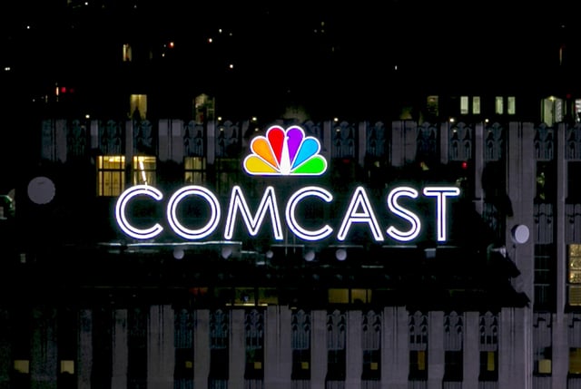 The NBC and Comcast logo are displayed on top of 30 Rockefeller Plaza, formerly known as the GE building, in New York, New York, U.S. on July 1, 2015.  REUTERS/Brendan McDermid/File Photo