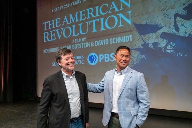 KQED President and Chief Executive Officer Michael Isip and documentarian Ken Burns greet each other at a preview of Burns’ upcoming PBS limited series “The American Revolution” at the Palace of Fine Arts in San Francisco on Wednesday, July 16.