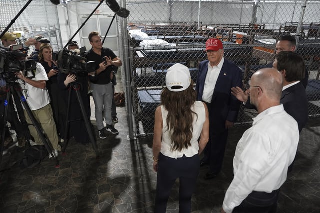 President Donald Trump, Gov. Ron DeSantis, R-Fla., and Homeland Security Secretary Kristi Noem, and others, tour "Alligator Alcatraz," a new migrant detention facility at Dade-Collier Training and Transition facility, Tuesday, July 1, 2025, in Ochopee, Fla. (AP Photo/Evan Vucci)