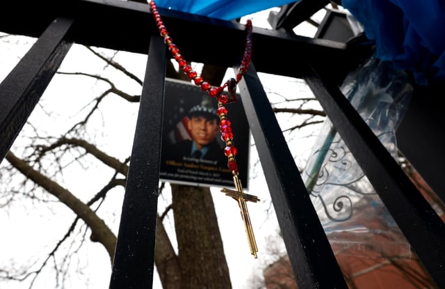 A rosary is among the items at a memorial for slain Chicago police Officer Andrés Mauricio Vásquez Lasso along the 5200 block of South Spaulding Avenue, March 3, 2023, in Chicago. (Stacey Wescott/Chicago Tribune)