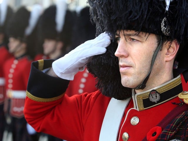 Lt. Col. Ryan Hendy, the commanding officer of the Cameron Highlanders salutes at a Remembrance Day ceremony in 2014.