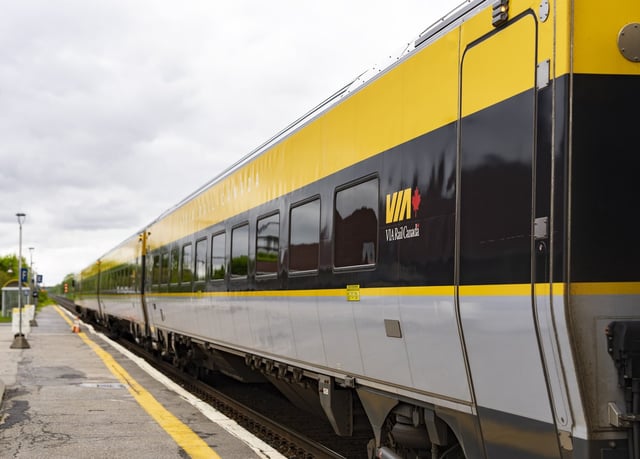A Via Rail train is seen on tracks in Dorval, Que., as it heads out of Montreal on Friday, May 23, 2025. THE CANADIAN PRESS/Christinne Muschi