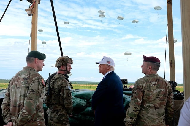 President Donald Trump and military leaders watch a demonstration by special operations soldiers at Fort Bragg, N.C., on June 10.