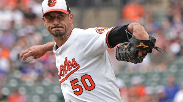 Jul 10, 2025; Baltimore, Maryland, USA;  Baltimore Orioles pitcher Charlie Morton (50) delivers in the first inning  against the New York Mets  at Oriole Park at Camden Yards. Mandatory Credit: Mitch Stringer-Imagn Images