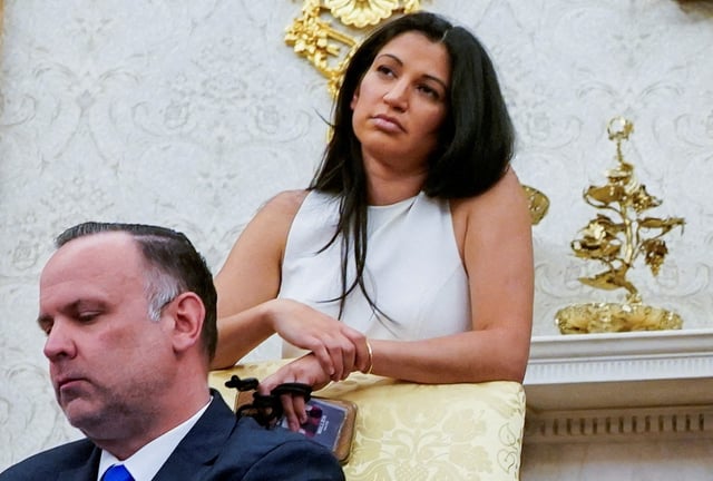 Katie Miller, wife of White House Deputy Chief of Staff for Policy Stephen Miller, and White House Deputy Chief of Staff Dan Scavino attend a press conference with U.S. President Donald Trump and Elon Musk, at the White House in Washington, D.C., U.S., May 30, 2025. REUTERS/Nathan Howard/File Photo