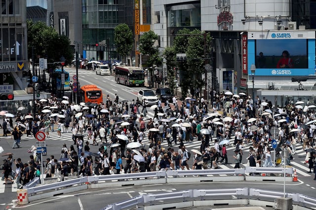 Tourists and pedestrians fill the streets of Shibuya on June 29, 2025 in Tokyo, Japan.