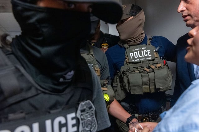 Federal agents patrol the halls of immigration court at the Jacob K. Javitz Federal Building on July 16, 2025, in New York City.