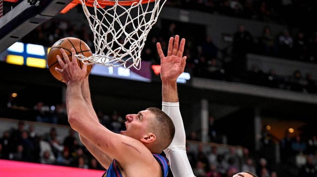 Nikola Jokic (15) of the Denver Nuggets works against Jonas Valanciunas (17) of the New Orleans Pelicans during the third quarter at Ball Arena in Denver on Friday, Jan. 12, 2024. (AAron Ontiveroz/The Denver Post/TNS)