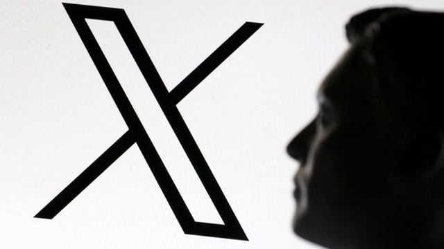 A 3D-printed miniature model of Elon Musk and the X logo are seen in this illustration taken January 23, 2025. REUTERS/Dado Ruvic/Illustration