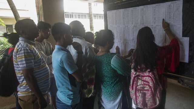Mumbai, India - July 5, 2018: Students and parents check the first merit list of FYJC at Ruia college, Matunga in Mumbai, India, on Thursday, July 5, 2018. (Photo by Pratik Chorge/Hindustan Times) (Pratik Chorge/HT Photo)