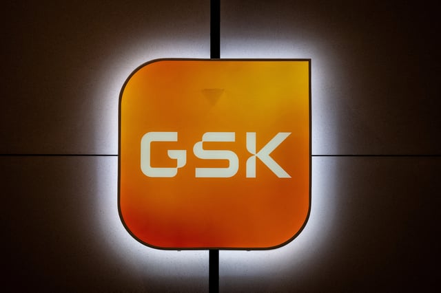 Signage is pictured in the main lobby of GSK offices in London, Britain, February 20, 2025. REUTERS/Chris J. Ratcliffe/File Photo
