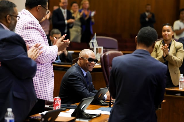 City Council members and staff clap for Ald. Walter Burnett, 27th, seated, during a the meeting at City Hall, July 16, 2025. Burnett is stepping down from City Council at the end of this month. (Eileen T. Meslar/Chicago Tribune)