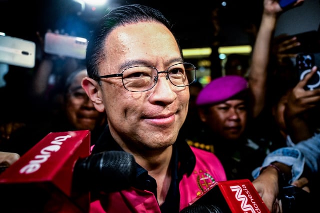 Thomas Trikasih Lembong, former Indonesian Trade Minister, leaves after being named a suspect and arrested late on Tuesday by prosecutors from the attorney general's office, according to the office he is accused of granting a permit to a private company at a time when Indonesia had a surplus of sugar, in Jakarta, Indonesia October 29, 2024, in this photo taken by Antara Foto. Antara Foto/Rivan Awal Lingga/ via REUTERS/File Photo