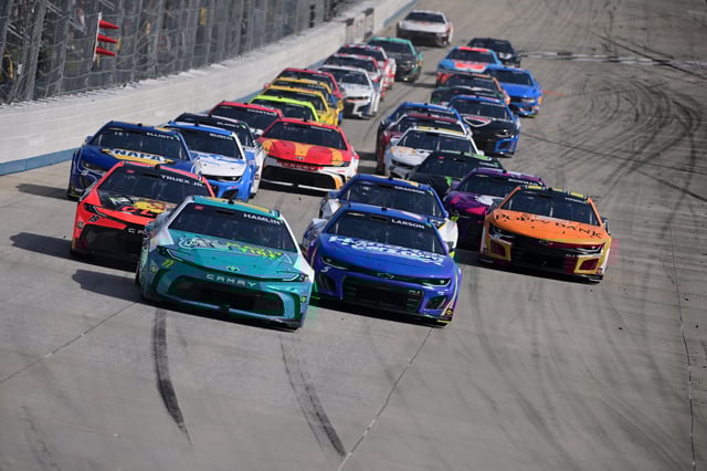 Denny Hamlin, driver of the #11 Mavis Tire Toyota, Kyle Larson, driver of the #5 HendrickCars.com Chevrolet, and Martin Truex Jr., driver of the #19 Bass Pro Shops Toyota, race during the NASCAR Cup Series Würth 400 at Dover International Speedway on April 28, 2024 in Dover, Delaware.
