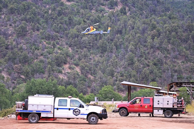Helicopter and fire engines at the site of Turner Gulch Fire in Gateway, Colorado on Wednesday, July 16, 2025. (Photo by Hyoung Chang/The Denver Post)