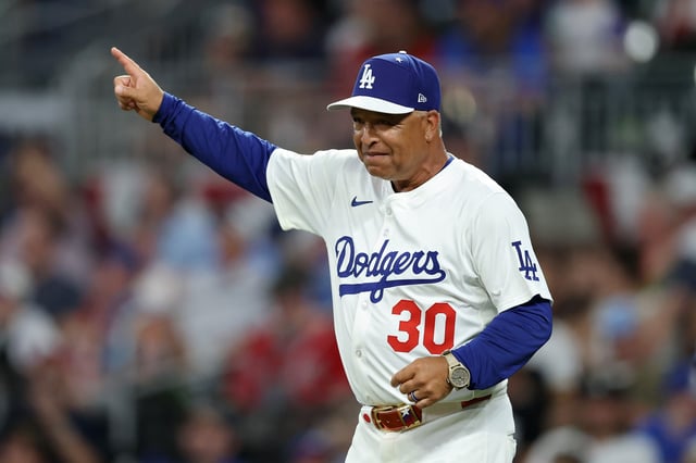 ATLANTA, GEORGIA - JULY 15: Manager Dave Roberts #30 of the Los Angeles Dodgers signals to the bullpen during the seventh inning of the MLB All-Star Game at Truist Park on July 15, 2025 in Atlanta, Georgia.